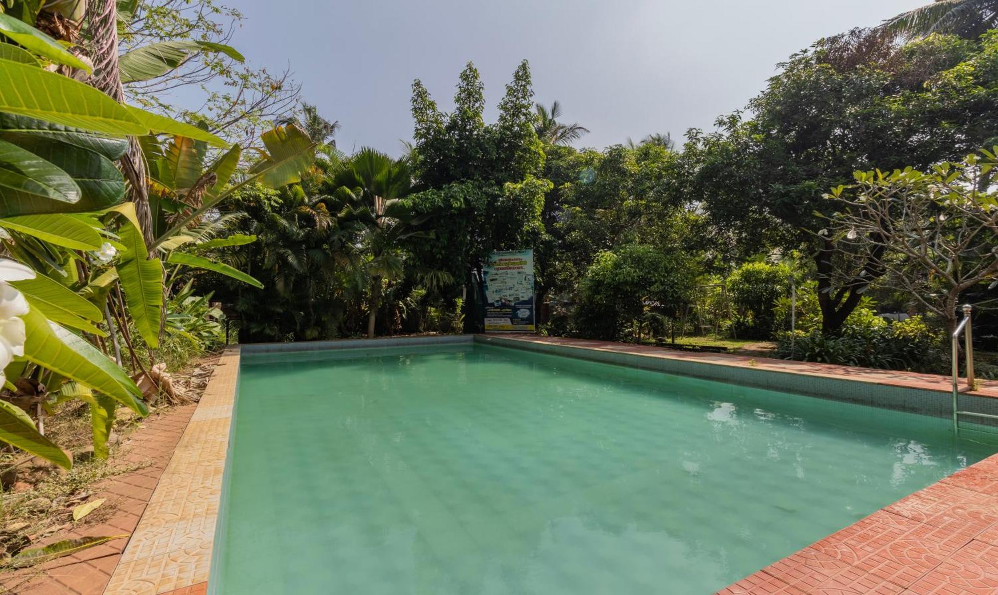 Hotel Treebo Sadhoo Heritage Ayurvedic Spa & Pool à Kannur Extérieur photo